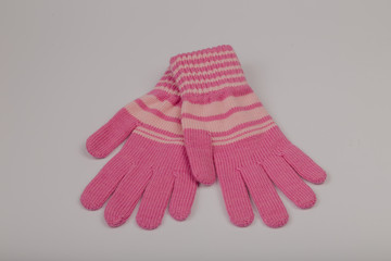 Children's winter gloves on a white background.