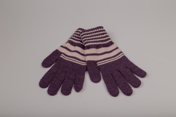 Children's winter gloves on a white background.