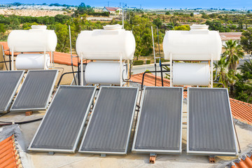 Solar thermal water heatihg system. Solar heat collectors. Solar power. Water heating from the sun. Sunny panels. Environmentally friendly consumption of resources. Pool maintenance. © Grispb