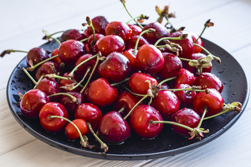 Cherries in bowl on a table, ripe berry