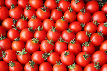 Red cherry tomatoes as background