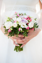 wedding bouquet in bride's hands  