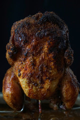  raw chicken and burned whole chicken after  cooking