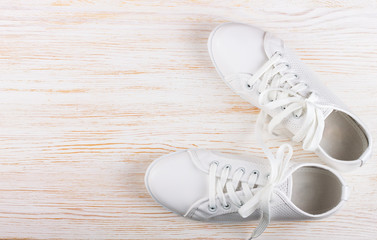 white sneakers on color background. copy space.