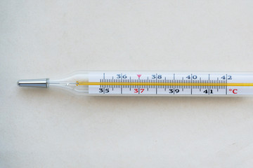 mercury thermometer to measure the body temperature of a sick person, overhead