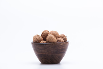 walnuts in a bowl isolated on white