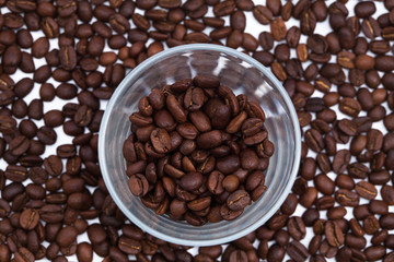 Coffee beans with a glass