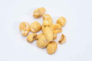 Roasted soft corn snack isolated on white
