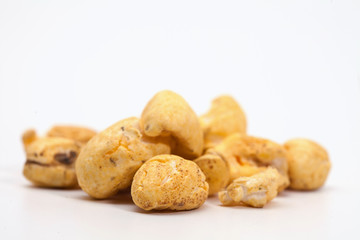 Roasted soft corn snack isolated on white