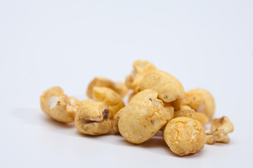Roasted soft corn snack isolated on white