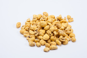 Roasted soft corn snack isolated on white