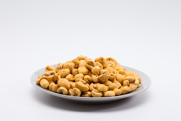 Roasted corn snack in a plate isolated
