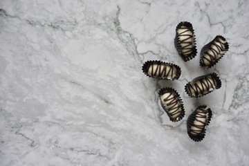 Chocolate almond london on a marble background.