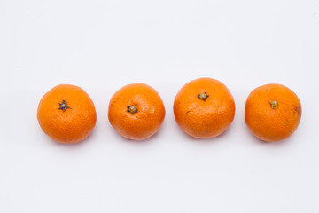 Fresh organic mandarin oranges on white