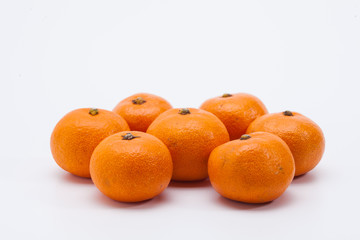 Fresh organic mandarin oranges on white