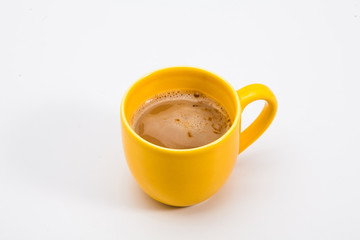 Yellow coffee mug on white background 