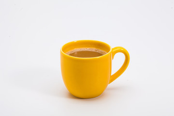Yellow coffee mug on white background 