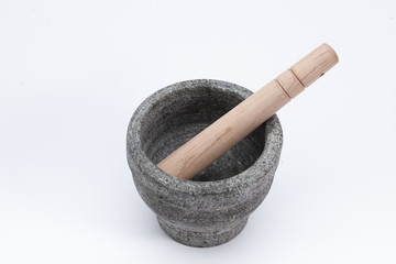 Stone mortar and wooden pestle isolated on white 