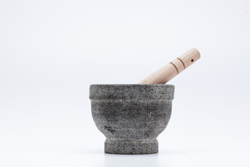 Stone mortar and wooden pestle isolated on white 