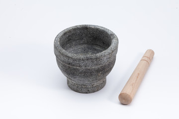 Stone mortar and wooden pestle isolated on white 