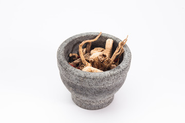 Medicinal herbs in stone mortar 