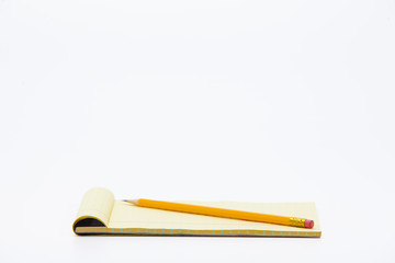 Yellow lined note paper isolated on white