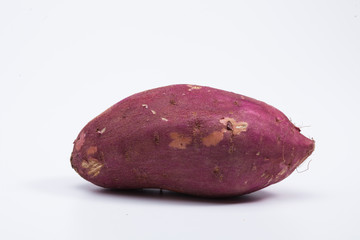 Red sweet potato isolated on white 