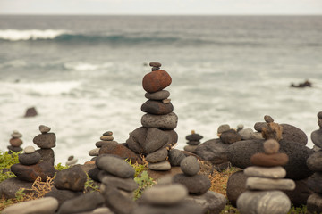sea ​​stones stacked on top of each other against the background of the ocean