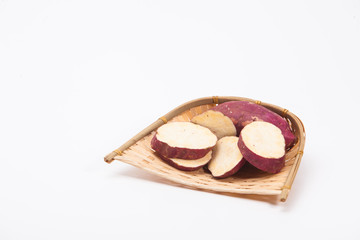 Red sweet potato in a bamboo winnow basket