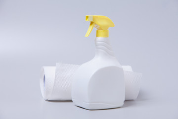 White spray bottle with fabric towel on gray