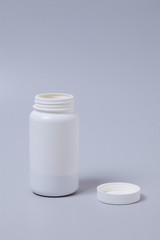  White medical container on gray background