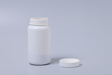  White medical container on gray background