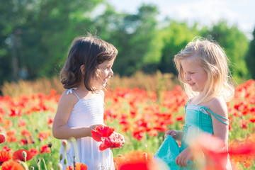 happy girls in a flower field