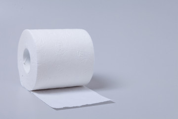 Toilet paper roll isolated on gray background