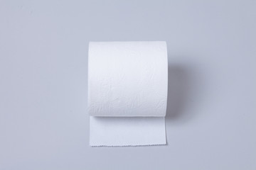 Toilet paper roll isolated on gray background