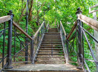 Fototapeta premium Park stairs leading up the mountain of metal and wood.