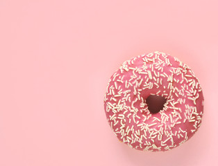 Delicious donuts on light pastel color background.