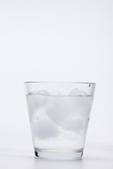 Cold ice water on white background