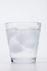 Cold ice water on white background