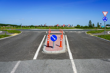 road infrastructure and road signs before the roundabout