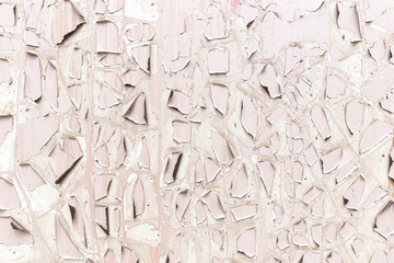 Pink and white cracked paint surface