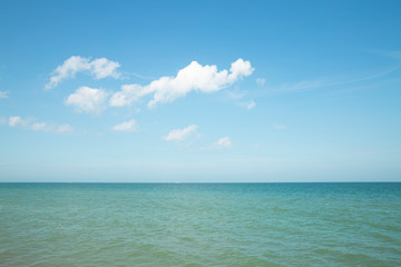 Fototapeta na wymiar Sea horizon with a cloud