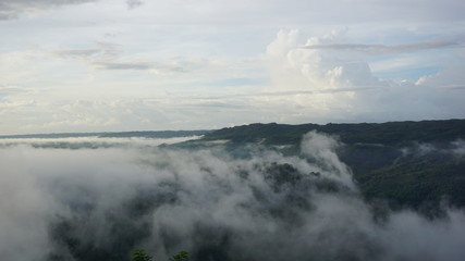 white clouds in the mountains are very beautiful, the atmosphere on a sunny morning