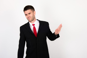 young businessman in black suit refuse to work and negatively respond to coworkers