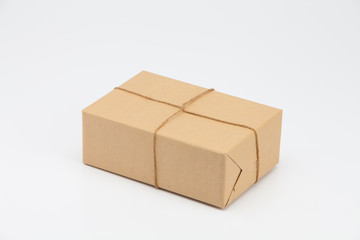 Brown kraft gift wrapped box on white