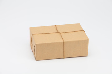 Brown kraft gift wrapped box on white