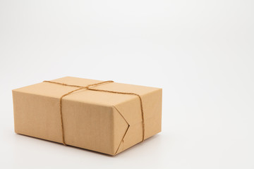 Brown kraft gift wrapped box on white