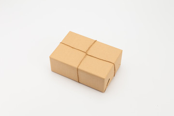 Brown kraft gift wrapped box on white