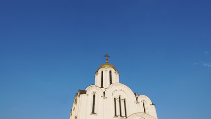 White church against the blue sky, Church of the Intercession of the Blessed Virgin, Belarus, Minsk