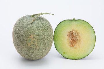 Cantaloupe melon slices isolated on white background